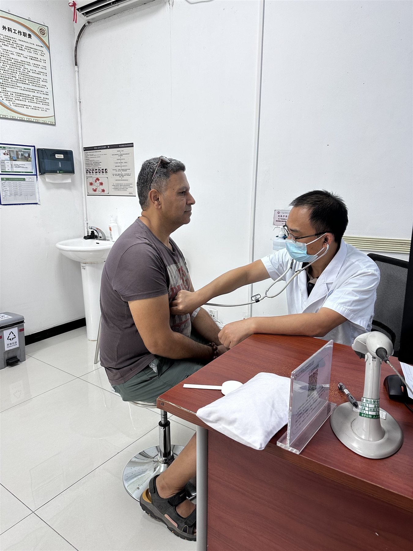 Doctor examining the client during the Shenzhen visit